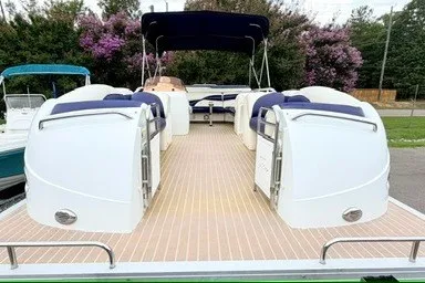 Slide: The Image of 2006 JC 23 Neptoon TT Triple Tube pontoon boat with spacious deck and seating. - 4