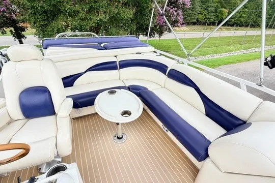 Slide: The Image of Luxurious seating on 2006 JC 23 NEPTOON TT boat with elegant blue and white upholstery. - 13