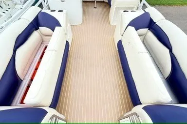 Slide: The Image of Interior view of 2006 JC 23 Neptoon TT boat with blue and white seating. - 8