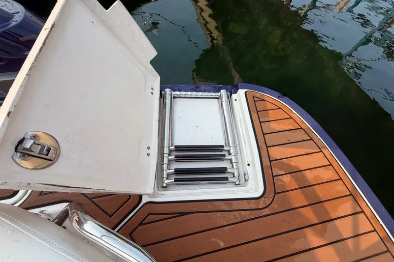 Slide: The Image of 2013 Monterey 264FSX boat swim platform with foldable ladder and teak decking. - 4