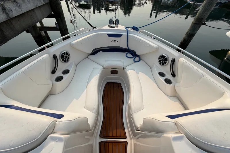 Slide: The Image of Luxurious 2013 Monterey 264FSX boat interior with white seating and wood accents. - 18