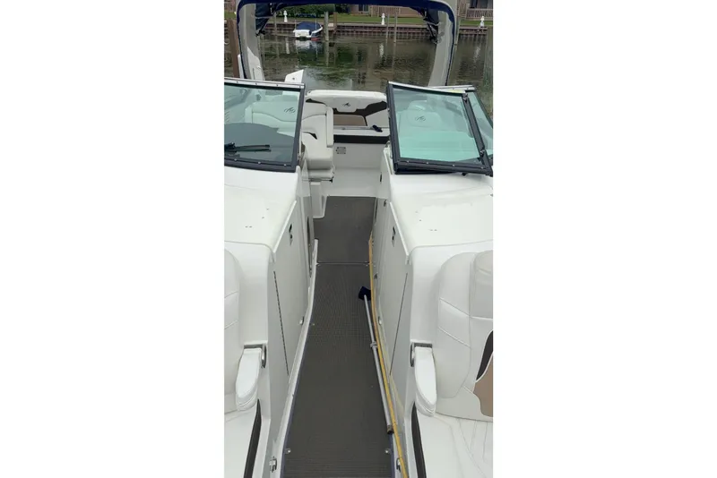 Slide: The Image of 2016 Monterey 328SS Super Sport boat interior with open deck and seating. - 23