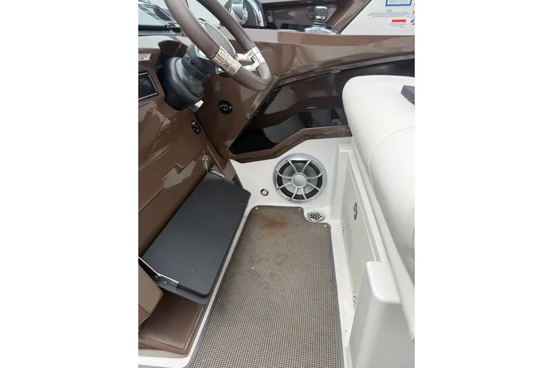 Slide: The Image of Interior of 2016 Monterey 328SS Super Sport boat, featuring steering wheel and speaker. - 28