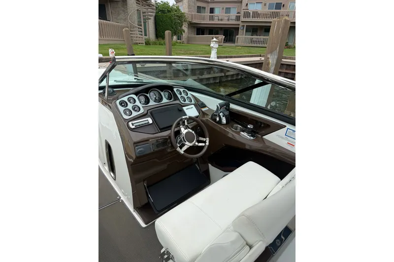 Slide: The Image of 2016 Monterey 328SS Super Sport boat cockpit with modern dashboard and steering wheel. - 17