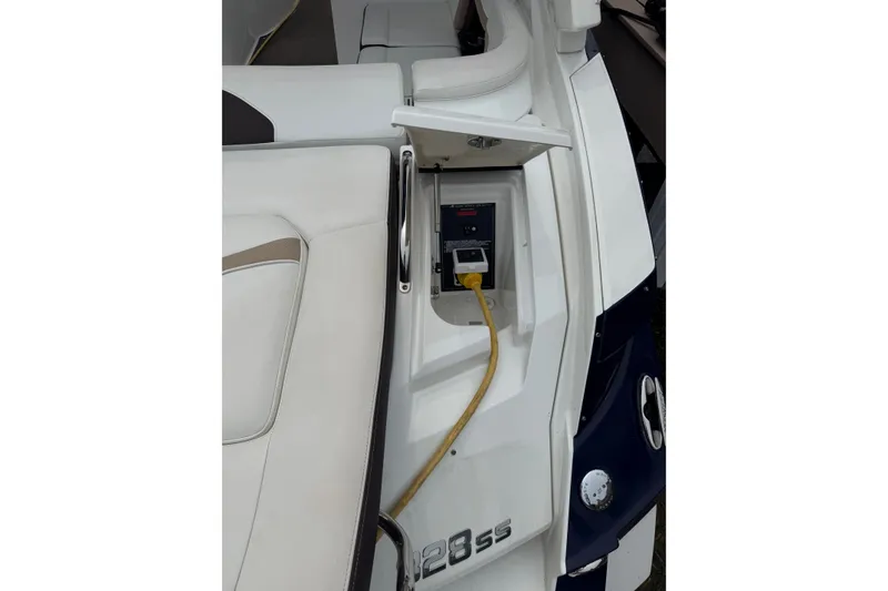 Slide: The Image of 2016 Monterey 328SS Super Sport boat with power connection and seating area. - 10