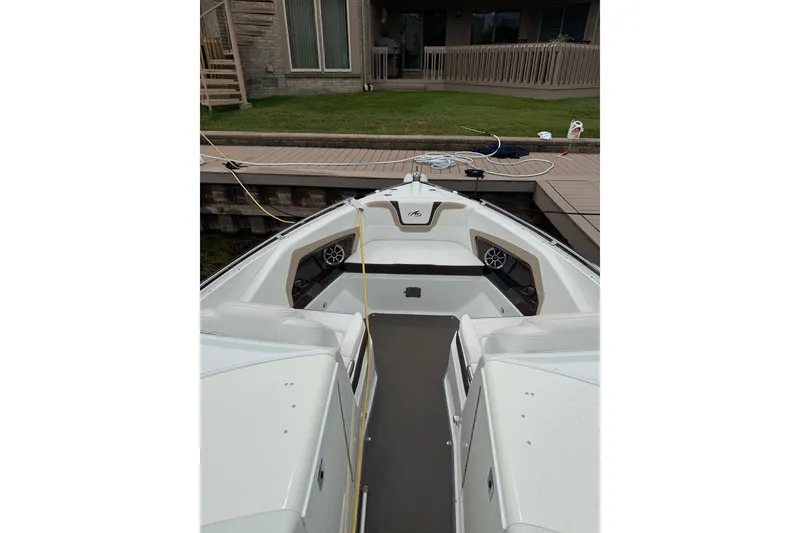Slide: The Image of 2016 Monterey 328SS Super Sport boat docked, featuring spacious seating and modern design. - 3