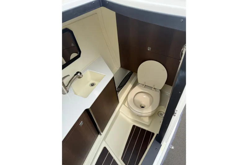 Slide: The Image of Interior of 2016 Monterey 328SS Super Sport boat bathroom with sink and toilet. - 15