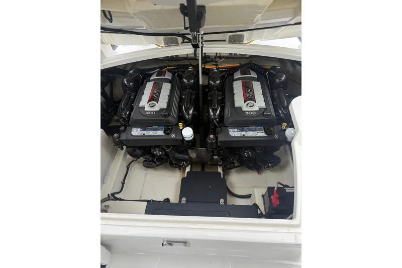 Slide: The Image of Engine compartment of a 2016 Monterey 328SS Super Sport boat, featuring dual engines. - 32