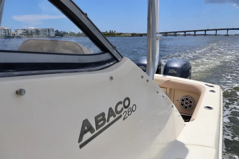 Slide: The Image of 2003 Scout 280 Abaco boat cruising on water with Yamaha engines. - 25