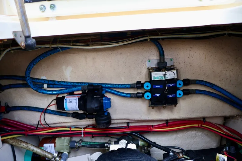 Slide: The Image of Engine compartment of a 2003 Scout 280 Abaco boat, showing wiring and plumbing systems. - 21