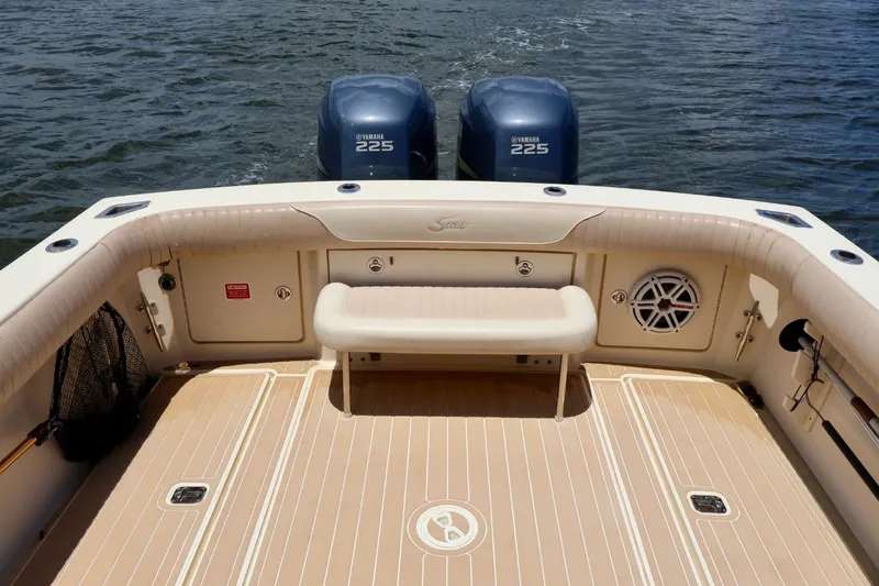Slide: The Image of 2003 Scout 280 Abaco boat deck with Yamaha 225 engines on water. - 26