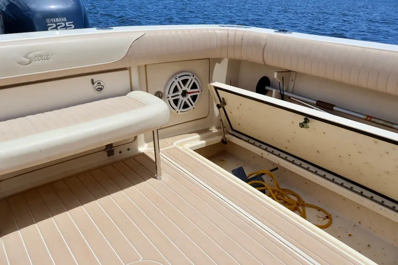 Slide: The Image of 2003 Scout 280 Abaco boat interior with storage compartment and Yamaha 225 engine. - 6