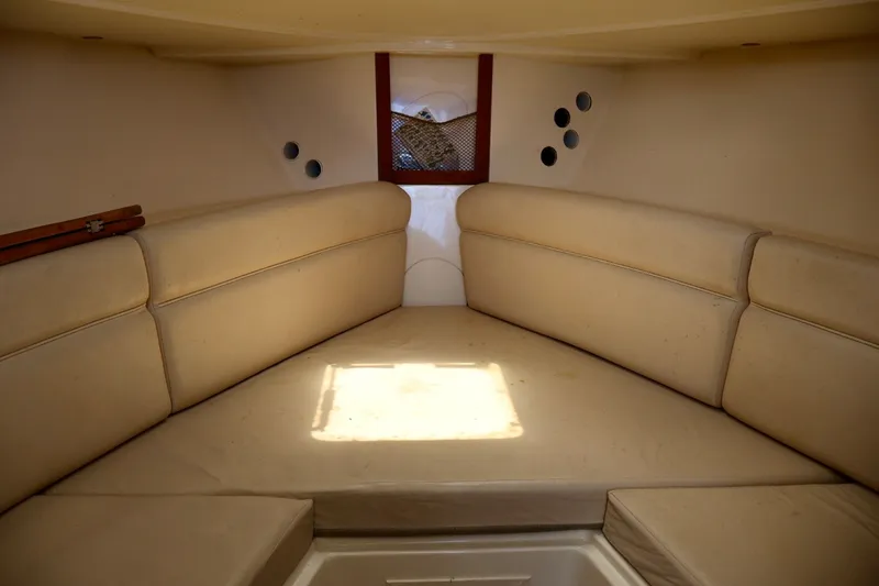 Slide: The Image of Interior cabin of 2003 Scout 280 Abaco boat with beige seating. - 16