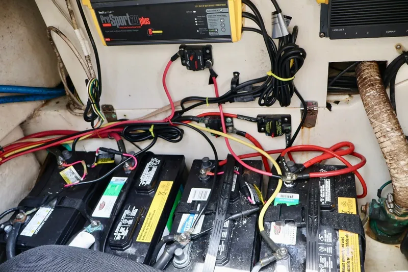 Slide: The Image of Battery compartment of a 2003 Scout 280 Abaco boat with wiring and charger. - 20