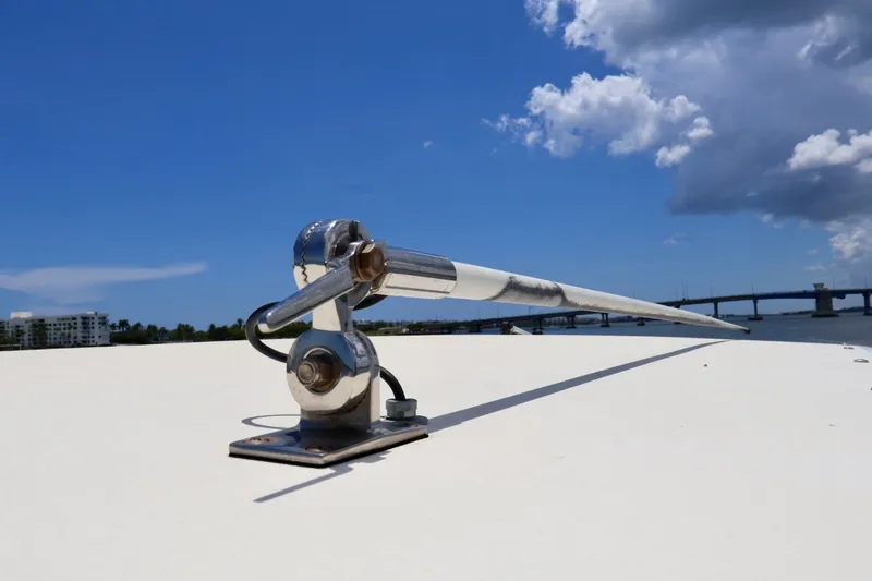 Slide: The Image of Antenna on 2003 Scout 280 Abaco boat under clear blue sky. - 24