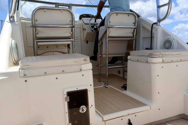 Slide: The Image of 2003 Scout 280 Abaco boat interior with seating and steering area. - 8