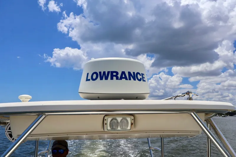 Slide: The Image of Radar equipment on a 2003 Scout 280 Abaco boat under a cloudy sky. - 23