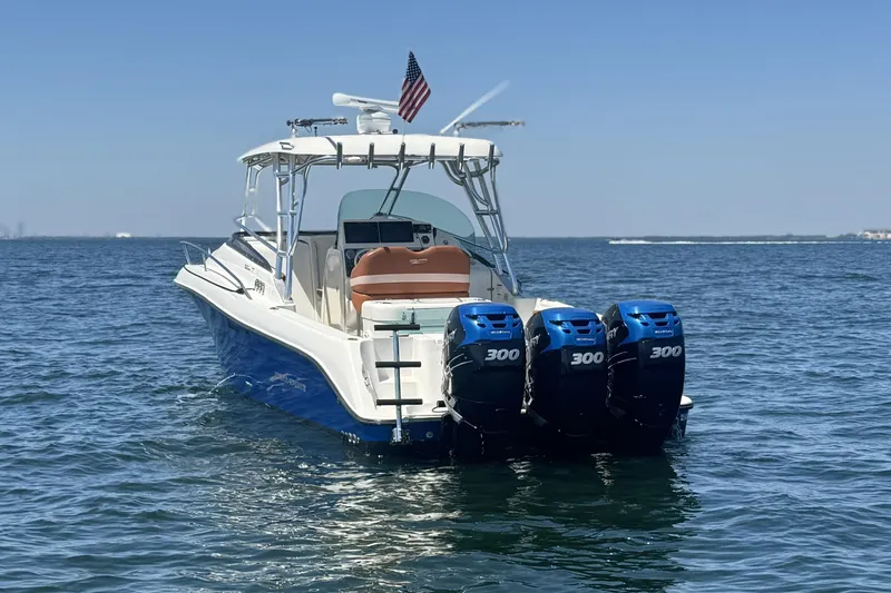 Slide: The Image of 2005 Hydra-Sports Vector 3300 VX boat with triple 300 horsepower engines on open water. - 2