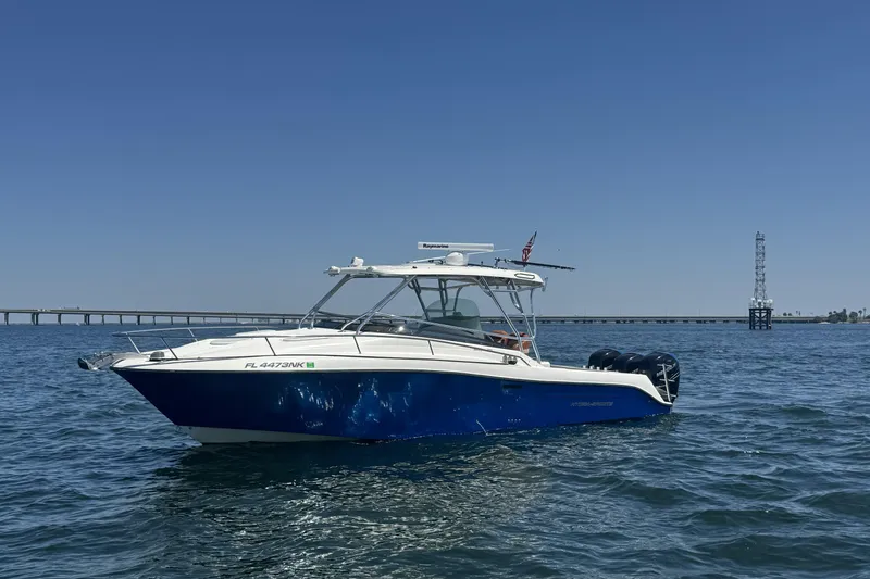 Slide: The Image of 2005 Hydra-Sports Vector 3300 VX boat on open water under clear blue sky. - 45