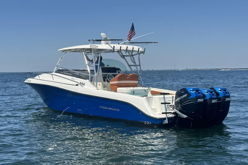 Slide: The Image of 2005 Hydra-Sports Vector 3300 VX boat with triple Mercury engines on open water. - 4