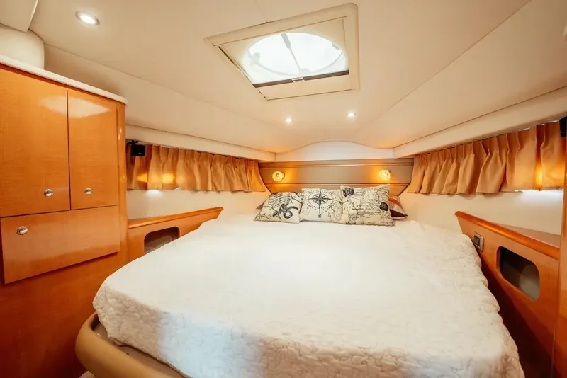 Slide: The Image of Luxurious cabin interior of 2009 Four Winns V458 yacht with cozy bedding. - 11