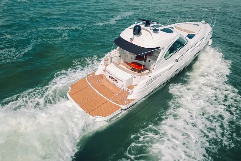 Slide: The Image of 2009 Four Winns V458 yacht cruising on open water, aerial view. - 4