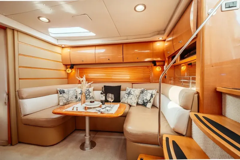 Slide: The Image of Luxurious interior of 2009 Four Winns V458 yacht with elegant seating and dining area. - 10