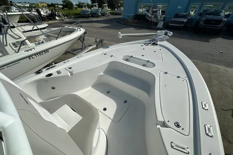 Slide: The Image of 2018 Sea Pro 248 Bay boat interior with seating and storage compartments. - 9