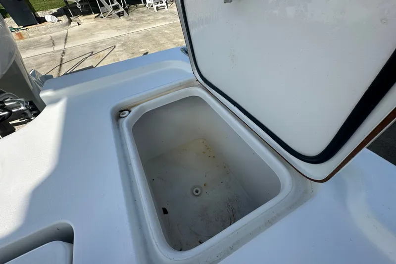 Slide: The Image of Open storage compartment on a 2018 Sea Pro 248 Bay boat. - 19