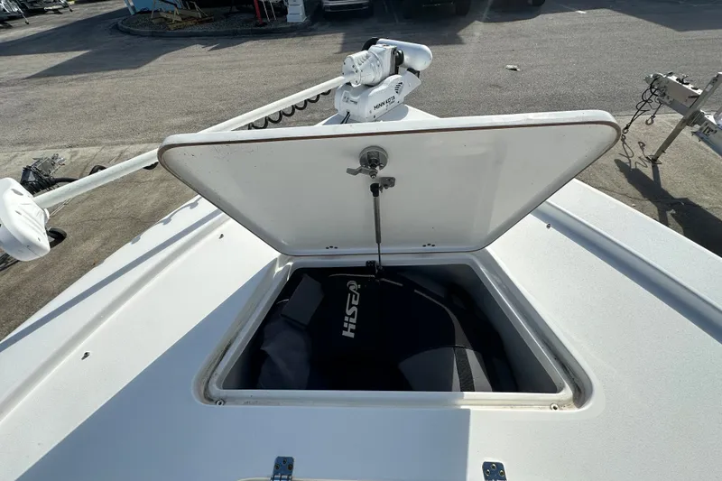 Slide: The Image of Open storage compartment on 2018 Sea Pro 248 Bay boat deck. - 10