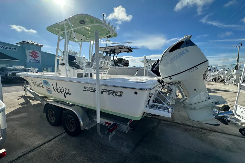 Slide: The Image of 2018 Sea Pro 248 Bay boat with Suzuki outboard motor on trailer. - 3