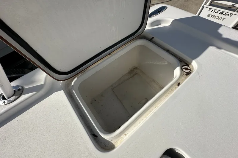 Slide: The Image of Open storage compartment on 2018 Sea Pro 248 Bay boat deck. - 21