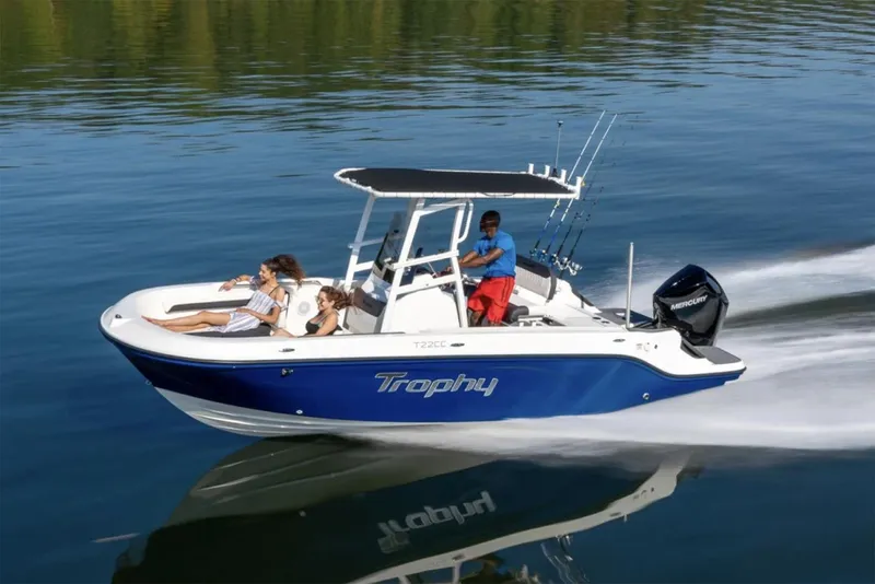 Slide: The Image of Manufacturer Provided Image: 2025 Bayliner Trophy T22CC boat cruising on calm water with passengers. - 25