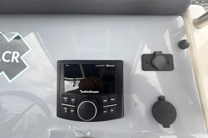 Slide: The Image of Control panel of 2025 Bayliner Trophy T22CC featuring Rockford Fosgate audio system. - 9