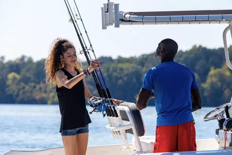 Slide: The Image of Manufacturer Provided Image: Two people fishing on a 2025 Bayliner Trophy T22CC boat. - 33