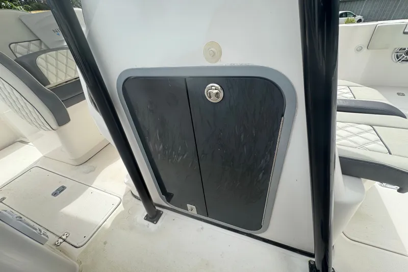 Slide: The Image of 2011 Donzi 29 ZF Open boat interior with storage compartment and seating. - 43