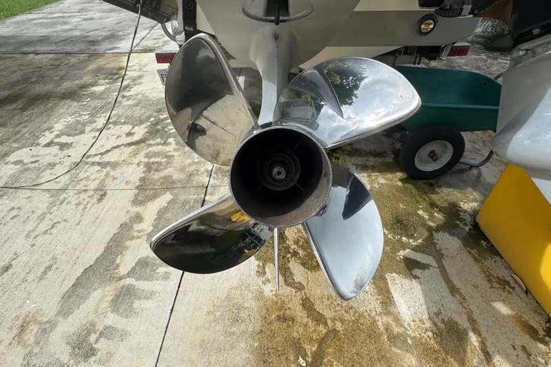 Slide: The Image of Close-up of a 2011 Donzi 29 ZF Open boat propeller on a concrete surface. - 55
