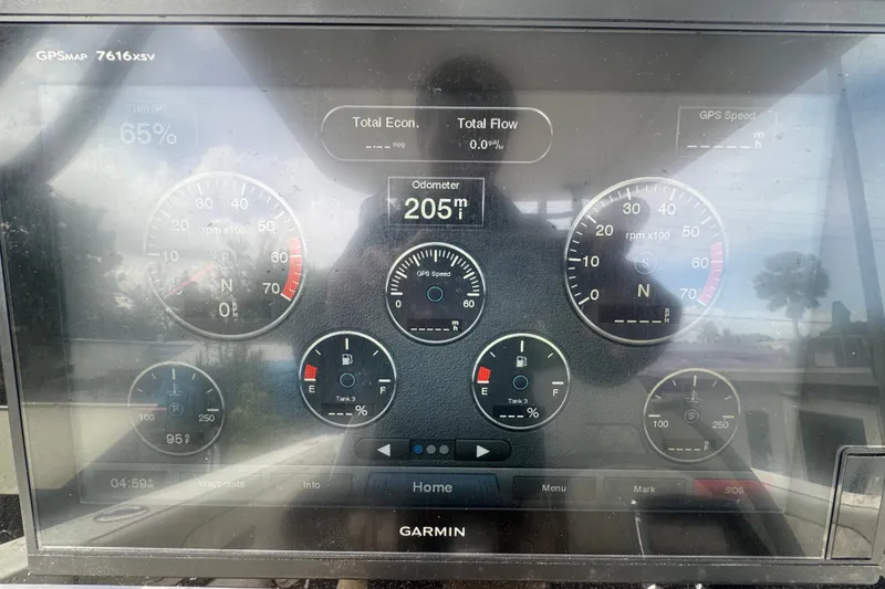 Slide: The Image of Garmin GPS display on 2011 Donzi 29 ZF Open boat showing odometer and gauges. - 31
