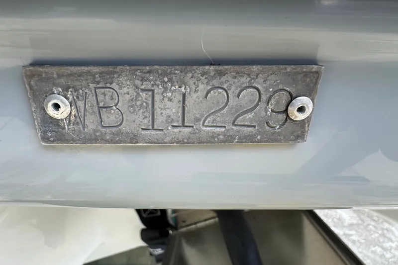 Slide: The Image of Close-up of a metal plate with "WB11229" on a 2011 Donzi 29 ZF Open boat. - 57