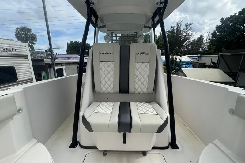 Slide: The Image of 2011 Donzi 29 ZF Open boat interior with dual seats and sleek design. - 41