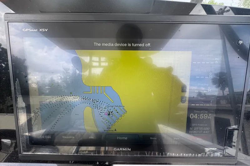Slide: The Image of Garmin GPS display on a 2011 Donzi 29 ZF Open boat, showing navigation map. - 32