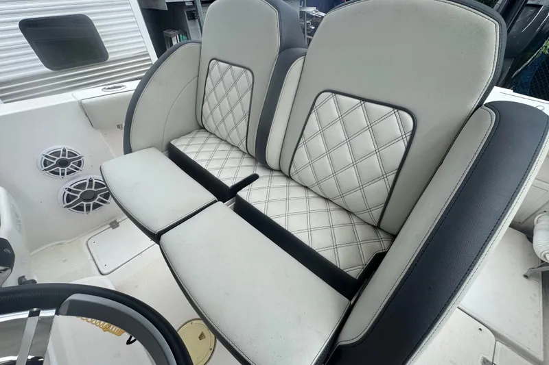 Slide: The Image of Luxury seating on 2011 Donzi 29 ZF Open boat with quilted upholstery. - 25