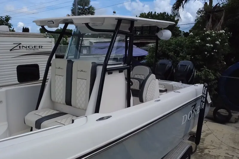 Slide: The Image of 2011 Donzi 29 ZF Open boat with sleek seating and modern design. - 11