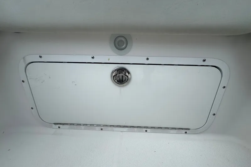 Slide: The Image of Storage compartment on a 2011 Donzi 29 ZF Open boat. - 18