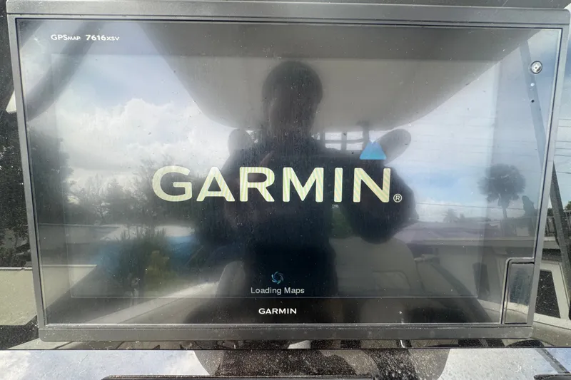 Slide: The Image of Garmin GPS display on 2011 Donzi 29 ZF Open boat, showing map loading screen. - 30