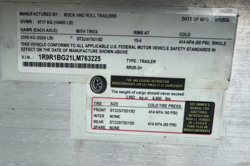 Slide: The Image of Label on Rock and Roll trailer, detailing weight and tire specifications, manufactured 07/2020. - 58