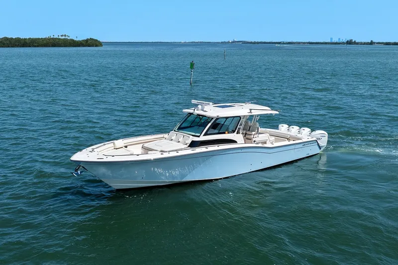 Slide: The Image of 2023 Grady-White Canyon 456 boat cruising on open water. - 6