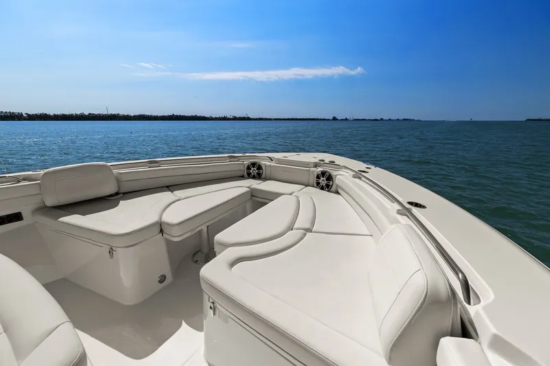 Slide: The Image of 2023 Grady-White Canyon 456 boat interior with luxurious seating on open water. - 61