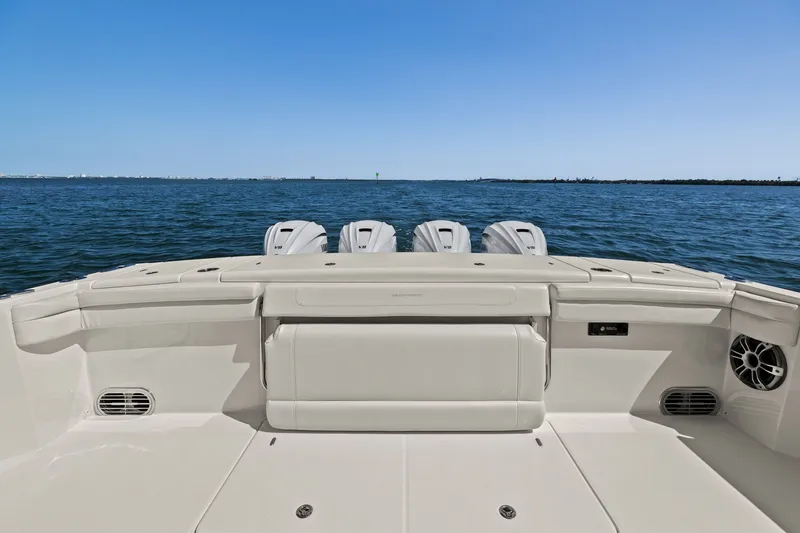 Slide: The Image of 2023 Grady-White Canyon 456 boat deck with ocean view and four engines. - 30