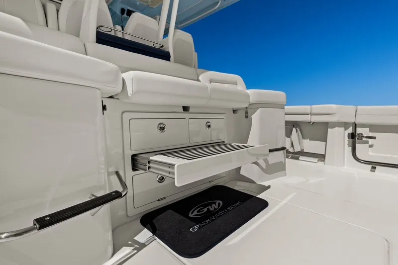 Slide: The Image of 2023 Grady-White Canyon 456 boat interior with seating and storage compartments. - 40